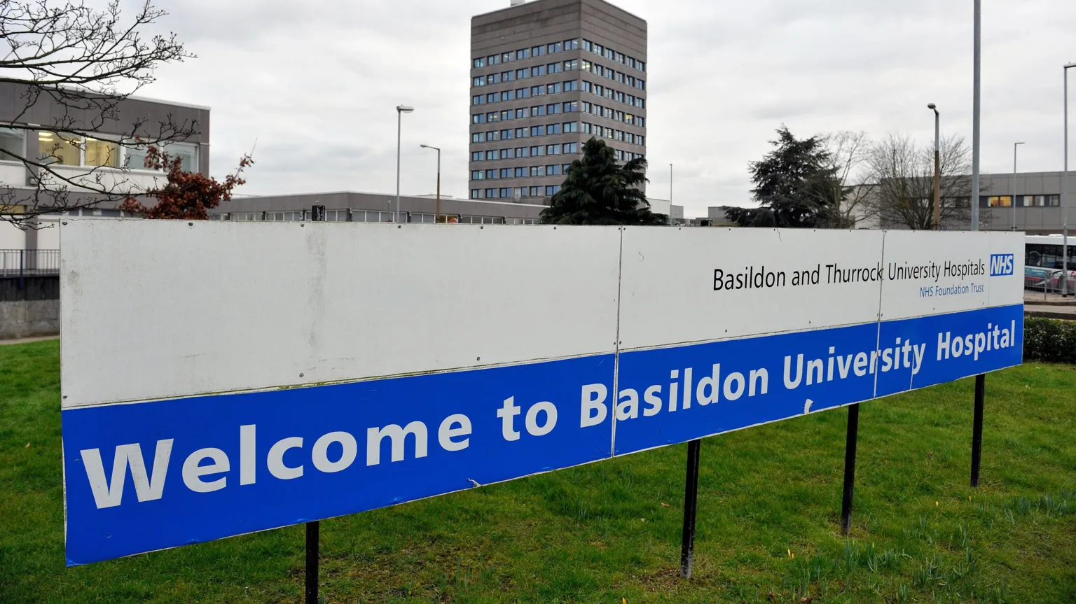  A blue and white hospital sign that reads: 