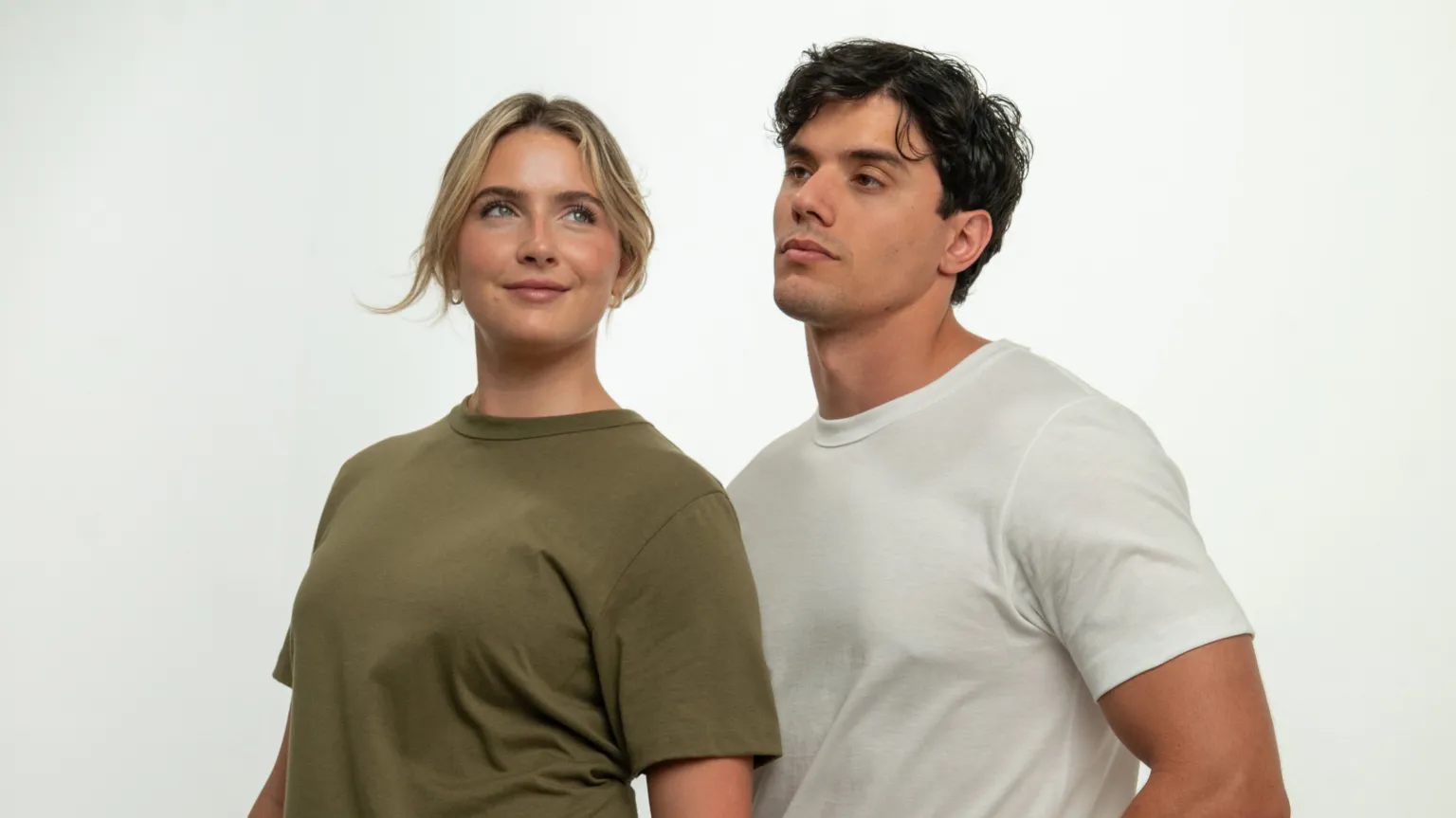 CreateMe A blonde female model wears a green t-shirt and a dark-haired male model wears a white t-shirt.