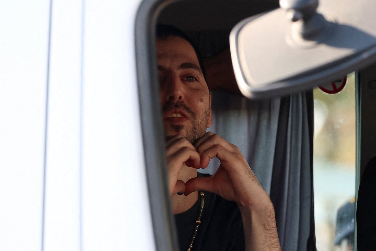 Elkana Bohbot gestures as he arrives at Sheba medical centre on 13 October 2025