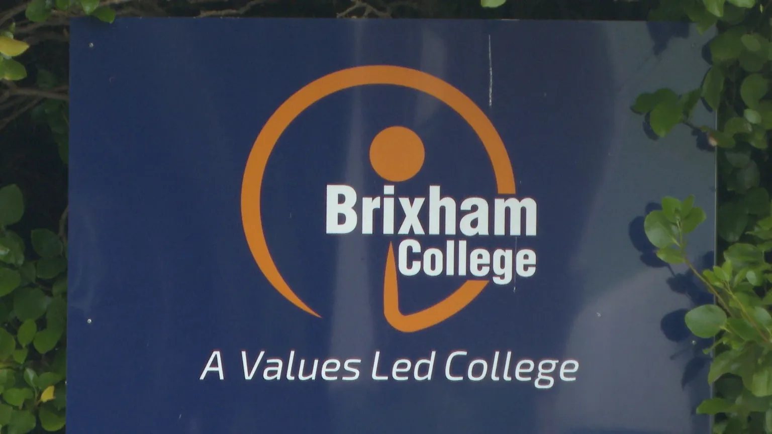 Brixham College sign outside the main gates saying