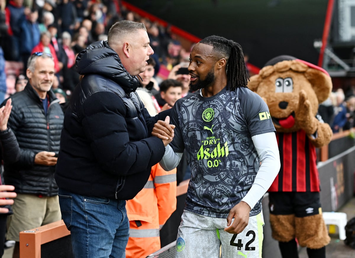 Manchester City's Antoine Semenyo speaks to an Bournemouth fan during the warm-up.