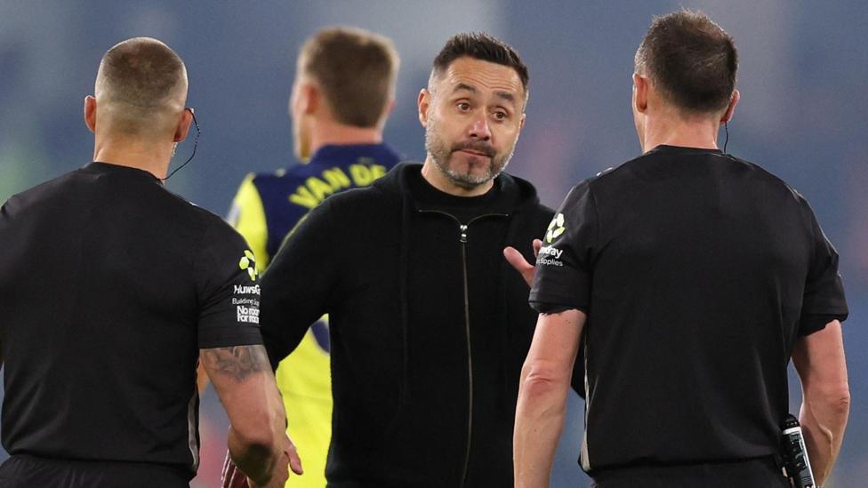 Spurs head coach in discussion with referee Stuart Attwell at the end of their Premier League loss to Chelsea at Stamford Bridge.