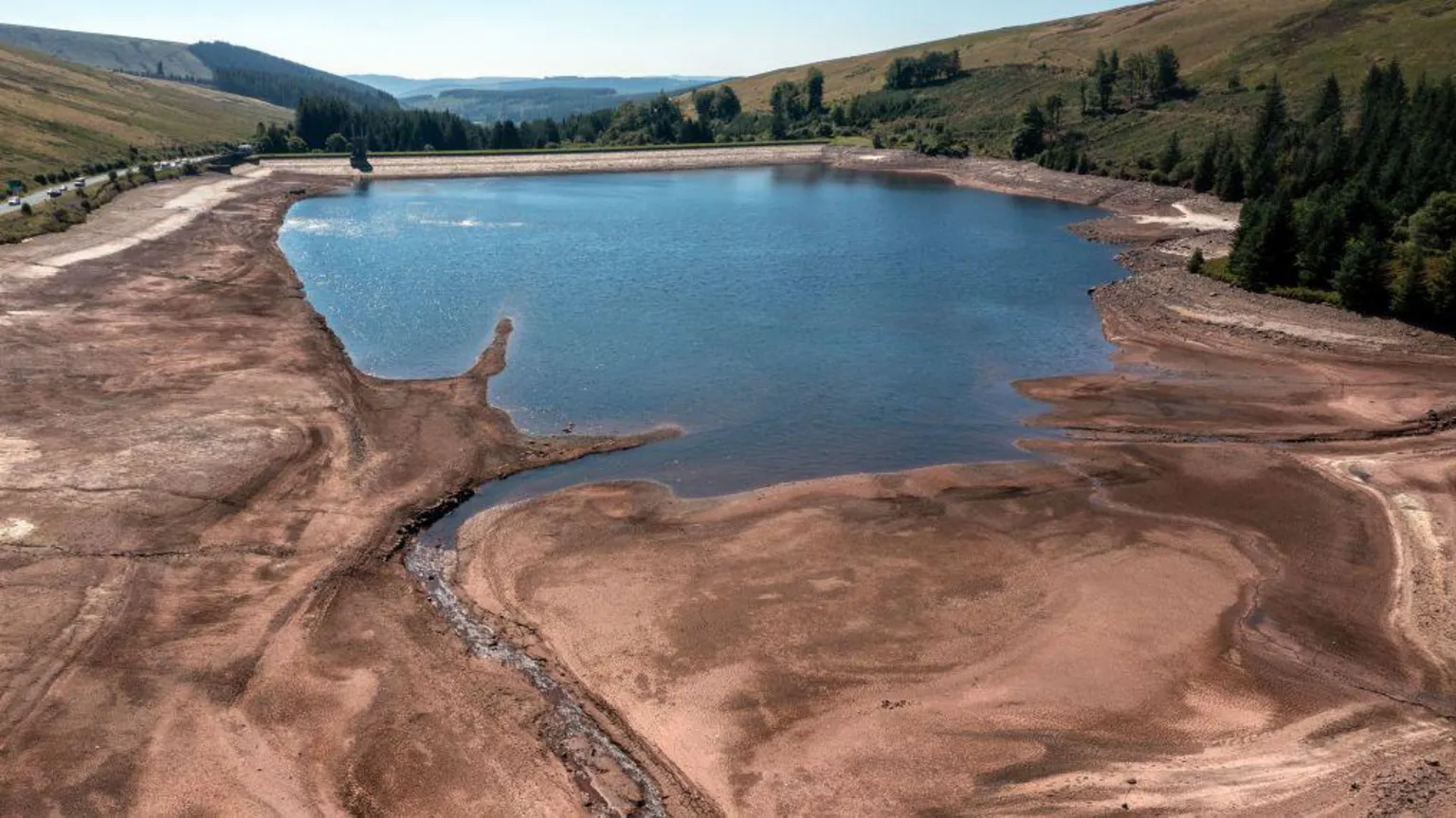 Carl Court/ The water level at Beacons Reservoir near Brecon lies low during a heatwave in 2022