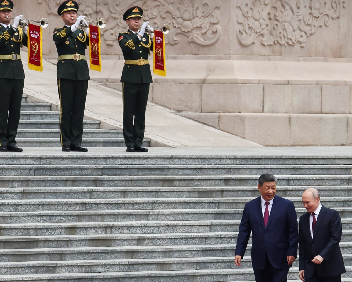 Russian president Vladimir Putin and Chinese president Xi Jinping attend a welcoming ceremony at the Great Hall of the People in Beijing, China.