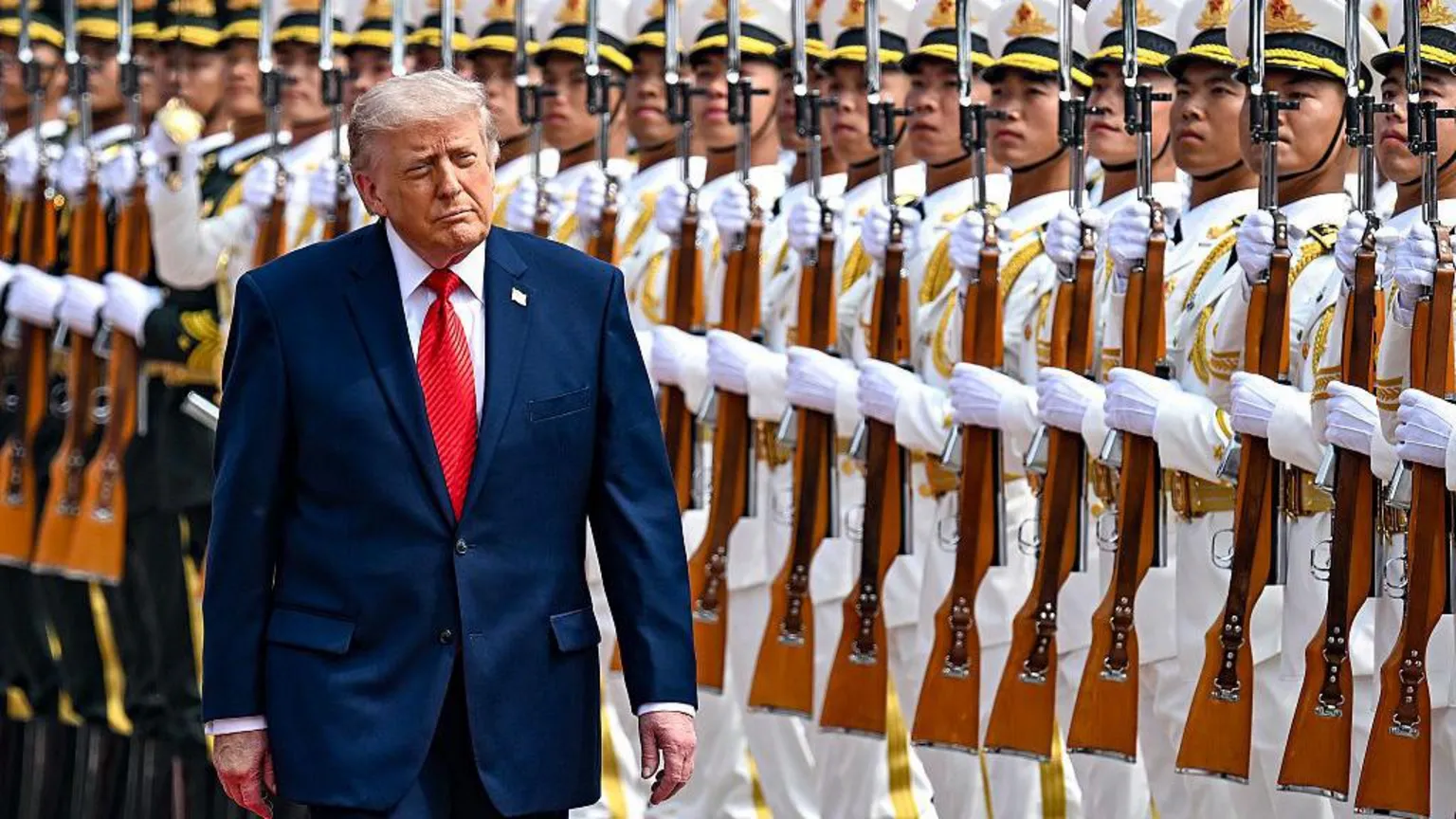 US President Donald Trump reviews an honor guard with Chinese President Xi Jinping during a welcome ceremony at the Great Hall of the People on May 14, 2026 in Beijing,