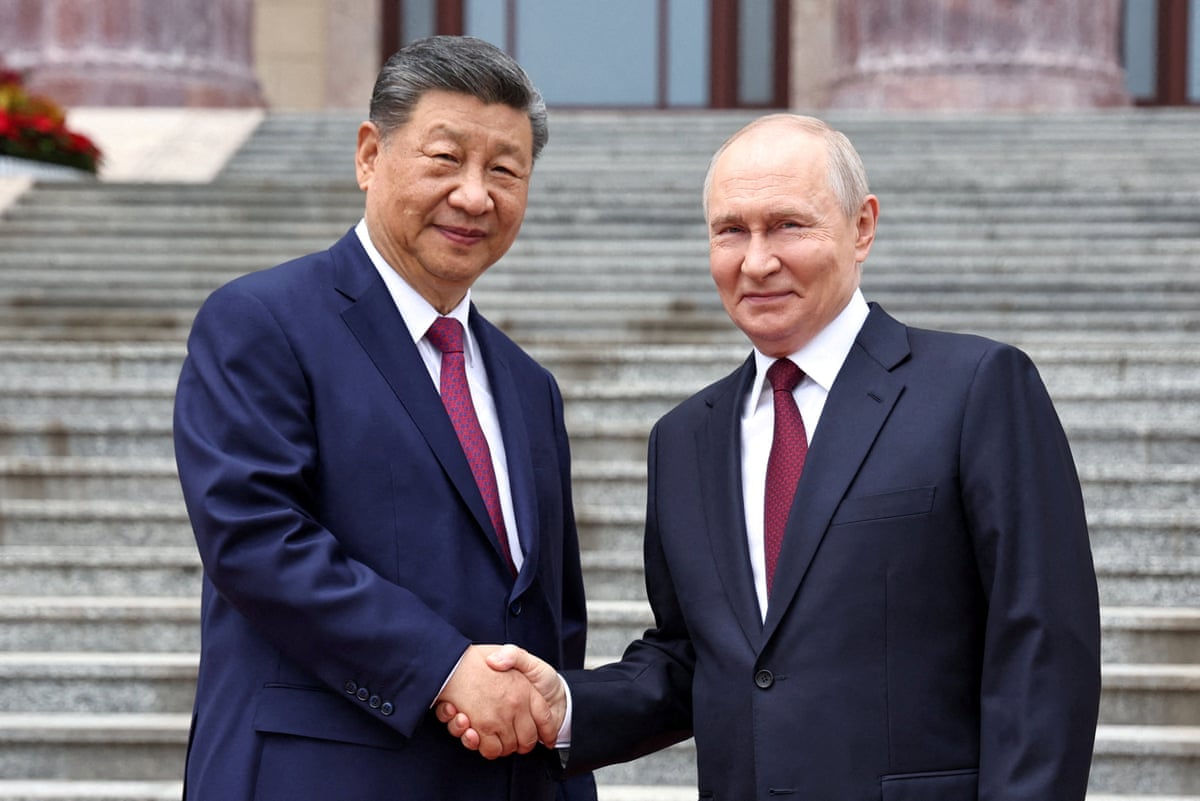 Chinese president Xi Jinping shakes hands with Russian president Vladimir Putin during a welcoming ceremony at the Great Hall of the People in Beijing.