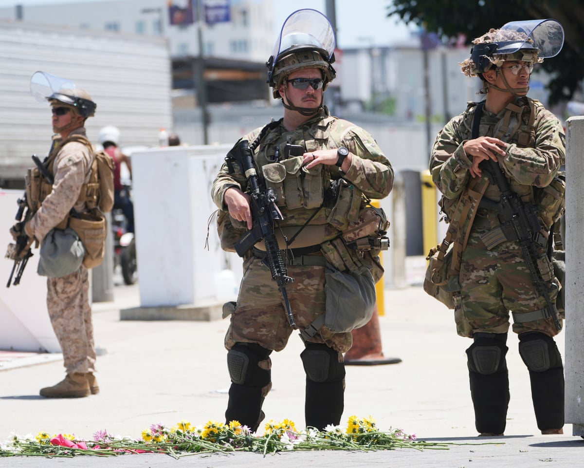 Members of the California National Guard and U.S. Marines guard a federal building on Tuesday, June 17, 2025, in Los Angeles. (AP Photo/Damian Dovarganes, File)