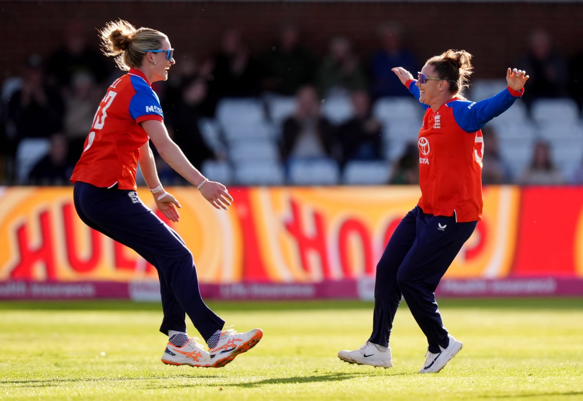 Lauren Bell prepares to embrace Linsey Smith after the dismissal of Melie Kerr for eight.