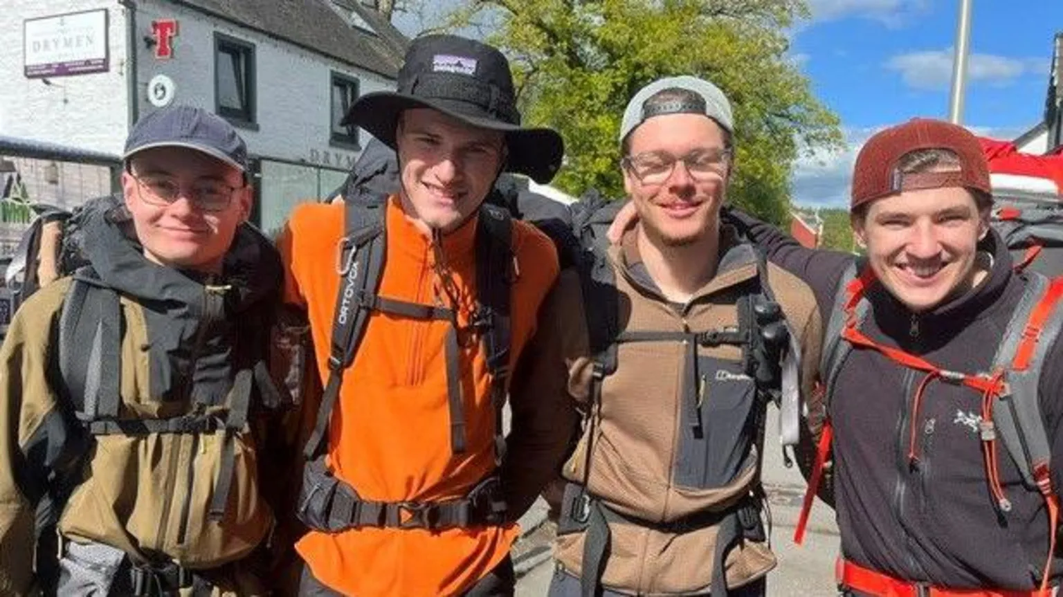 Pic of German walkers wearing hiking gear and back packs.