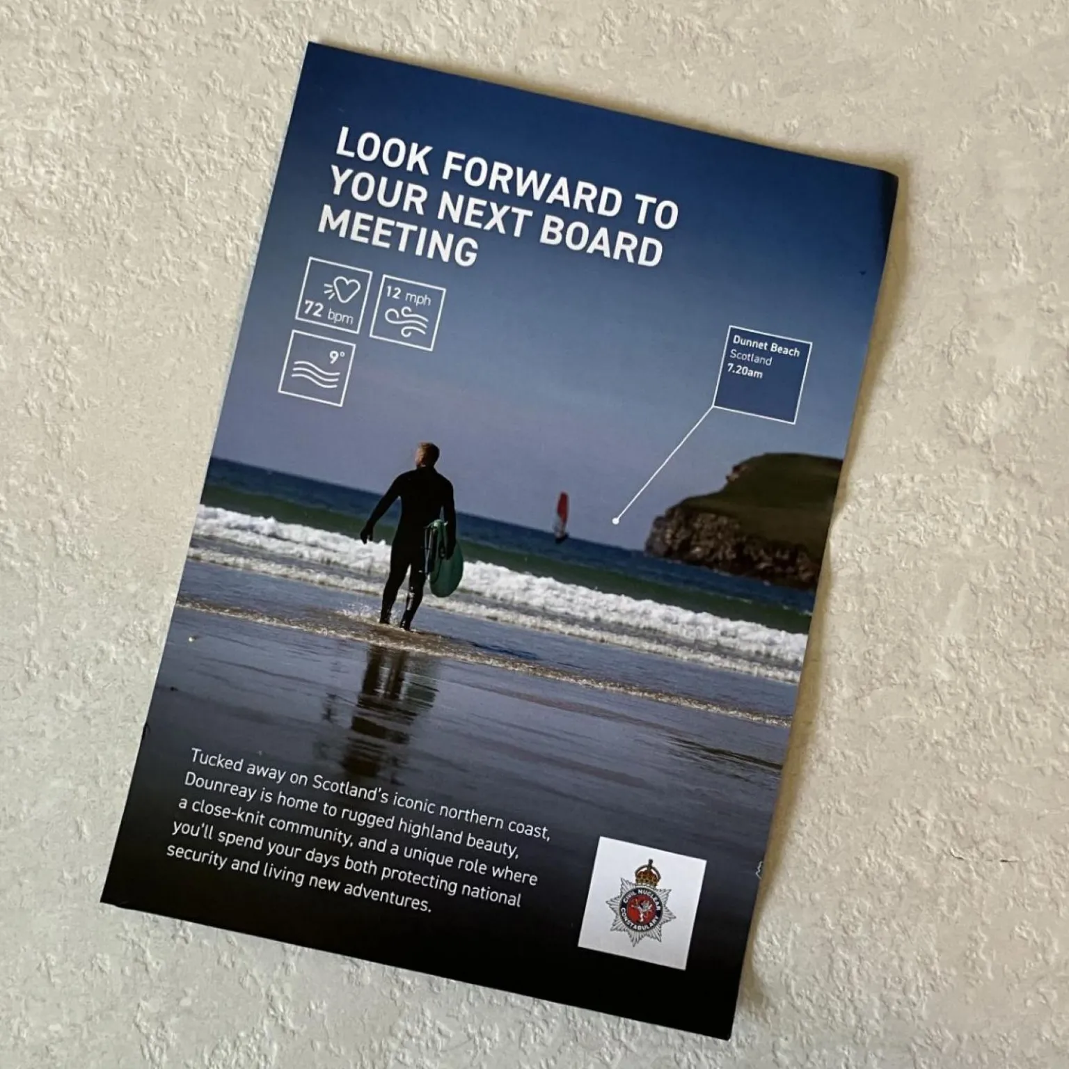 The flier shows a surfer carrying his board along a beach towards the sea. Words on the flier read: