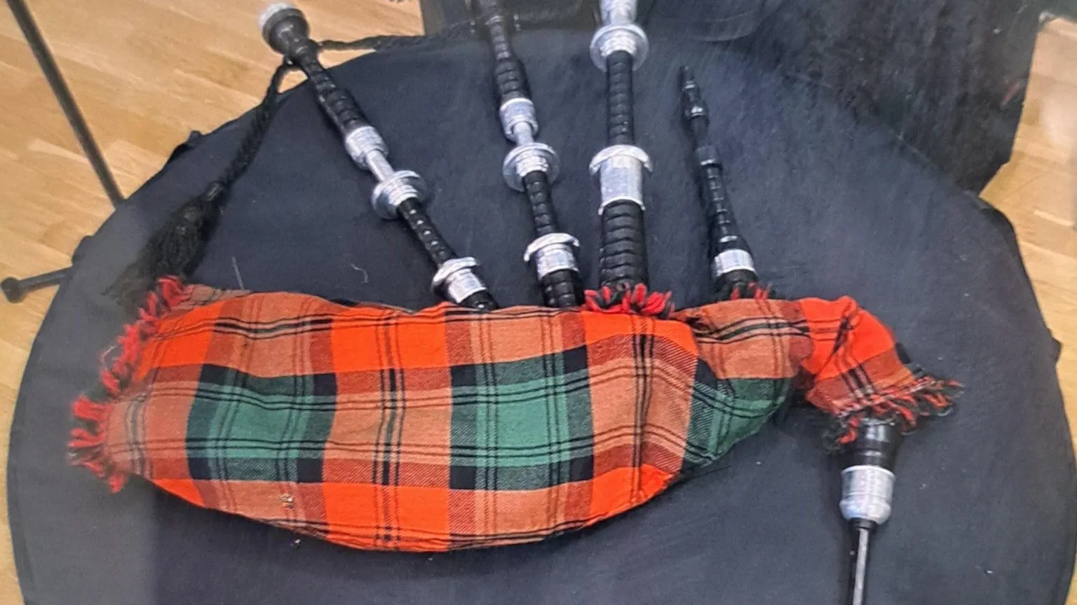 Northumbria Police A set of bagpipes in a red and green tartan
