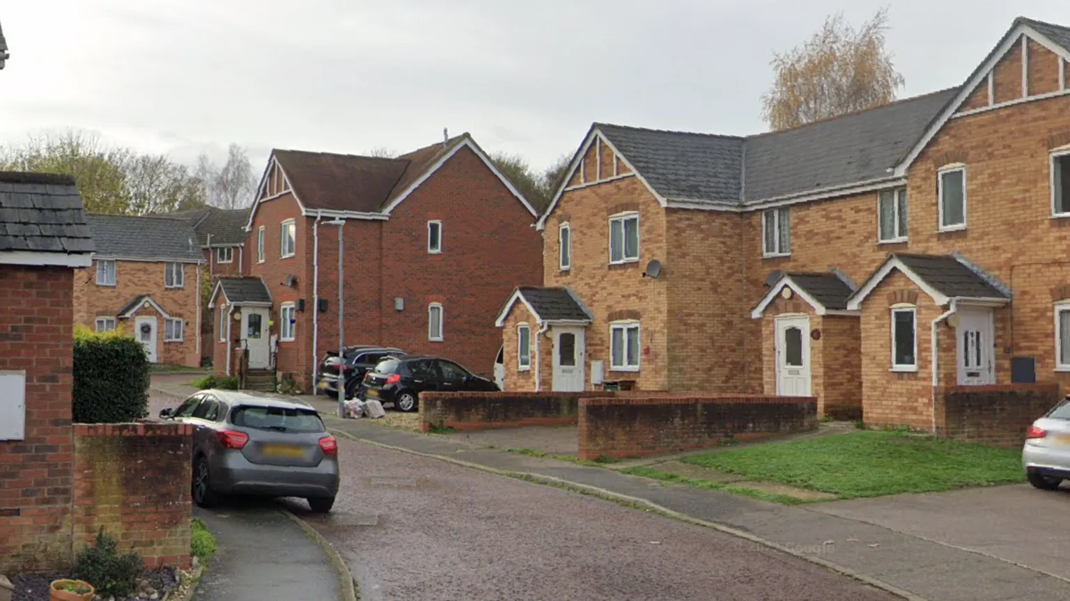 Google A general view of Geoff Seaden Close in Colchester. It is a narrow residential road lined with cream brick houses.