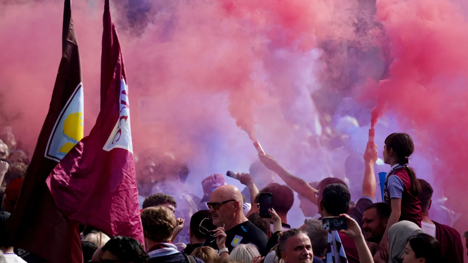 Smoke billows from flares as Villa fans gather in Birmingham.