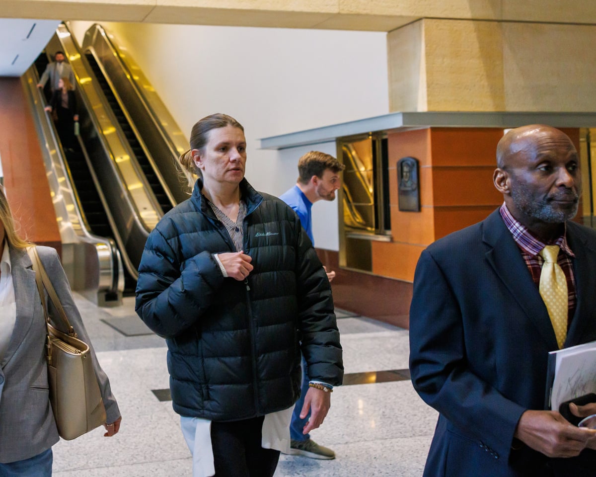 Aimee Bock, founder and executive director of the nonprofit Feeding Our Future, arrived at the Minneapolis federal courthouse with her attorney, Ken Udoibok, right, on 19 March 2025.