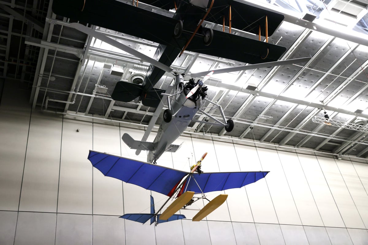 Two aircraft hanging from the ceiling.