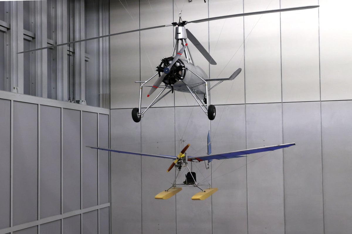 Two aircraft hanging from the ceiling.