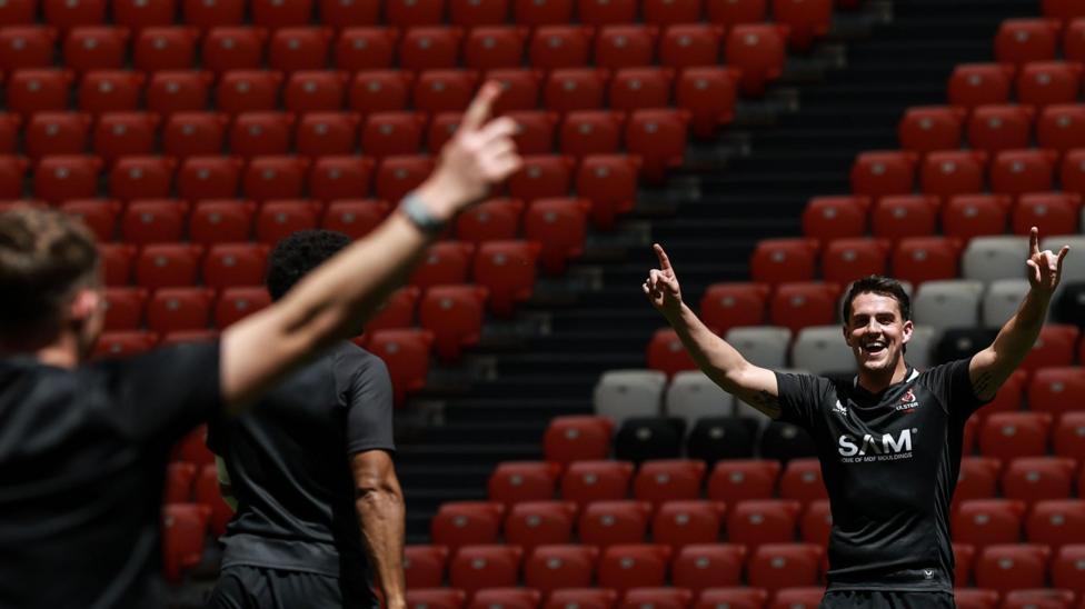 James Hume jokes with team-mates