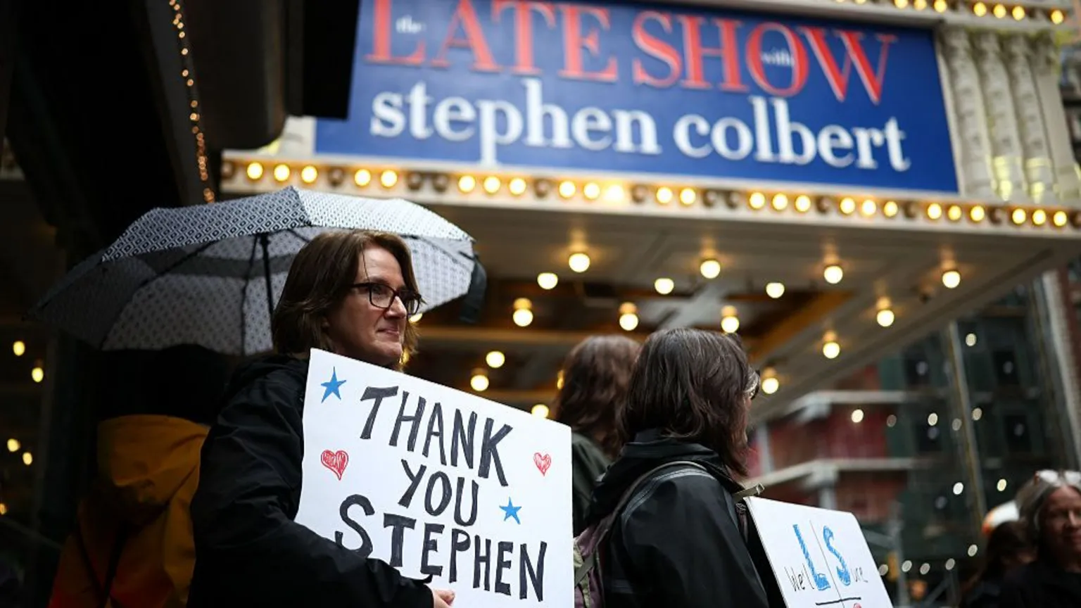 Charly Triballeau/AFP via Getty Image Fans standing outside the Ed Sullivan Theater with 