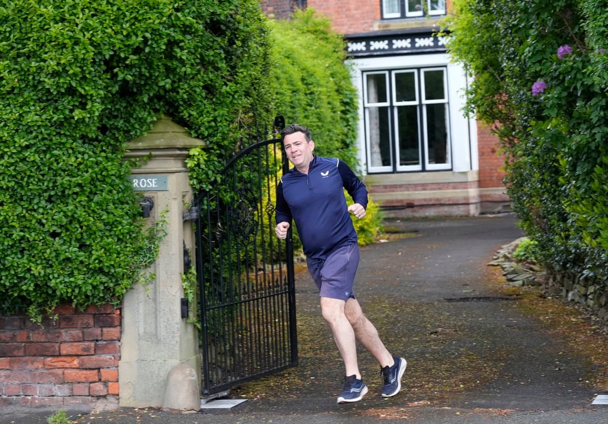 Andy Burnham jogs out of his house