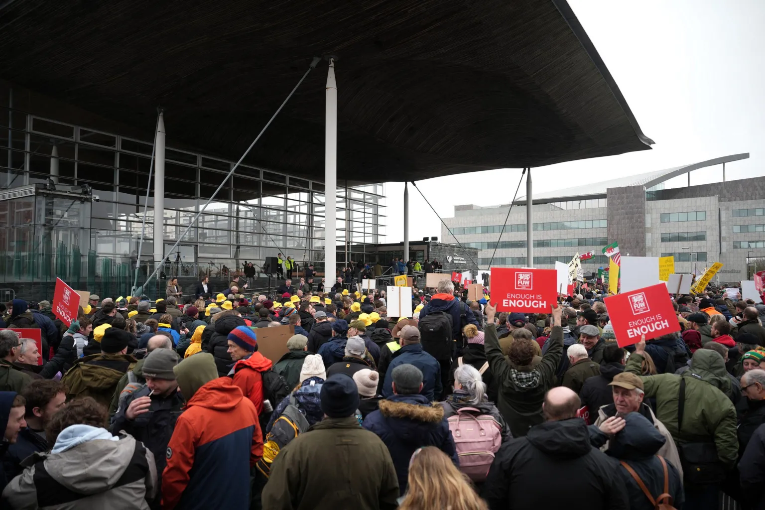 Getty Protesters holding placards gather outside the Senedd on February 28, 2024.