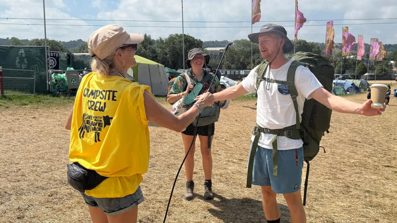 A woman wearing a yellow t-shirt that reads