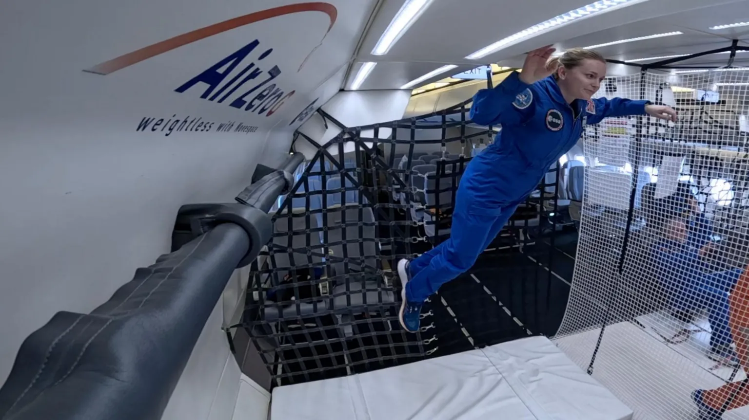 ESA/Novespace Dr Meganne Christian, an ESA reserve astronaut, floats to the top of the inside of a plane.
