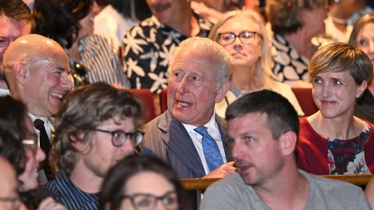 Jeff Spicer via King Charles III sits in the audience of a performance of The Tempest at the Royal Shakespeare Theatre.
