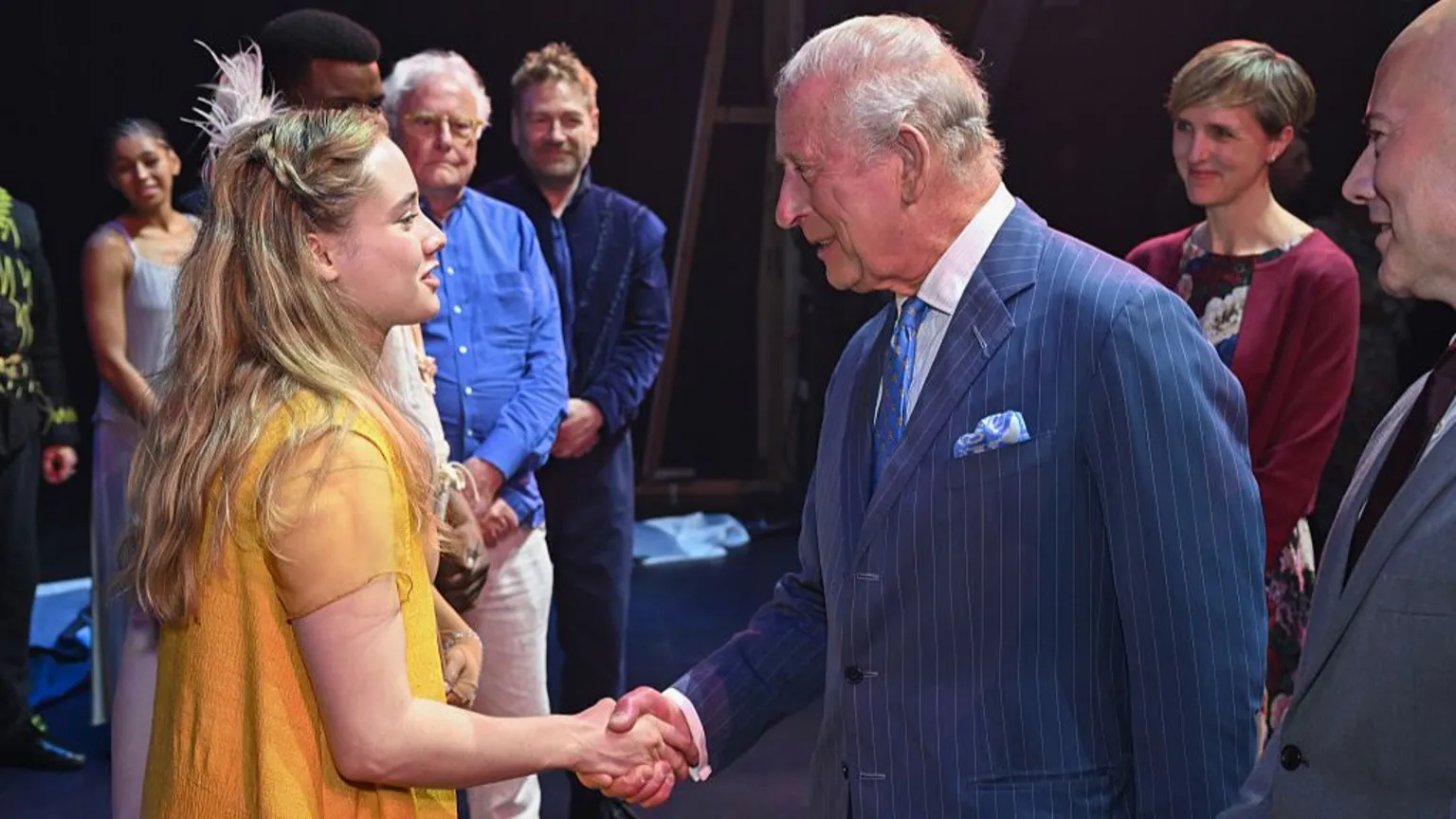 Jeff Spicer via King Charles III shakes hands as he meets members of the cast and crew backstage after the Royal Shakespeare Company