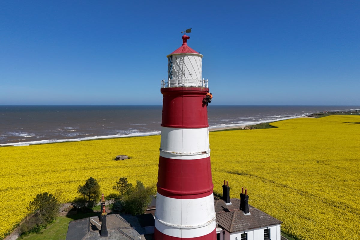 Rope access specialists abseil down Happisburgh Lighthouse in Norfolk