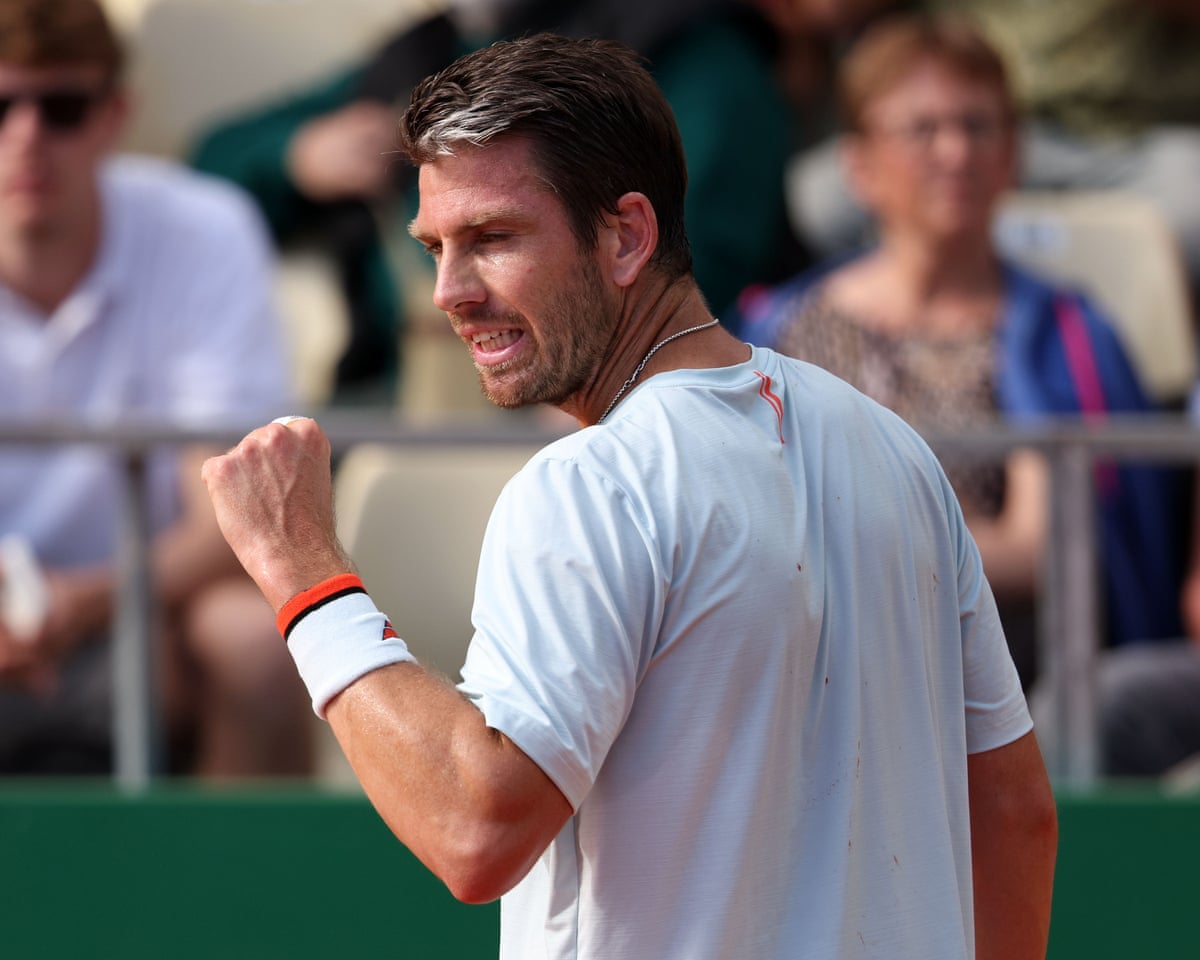 Cameron Norrie clenches his fist in celebration of a point