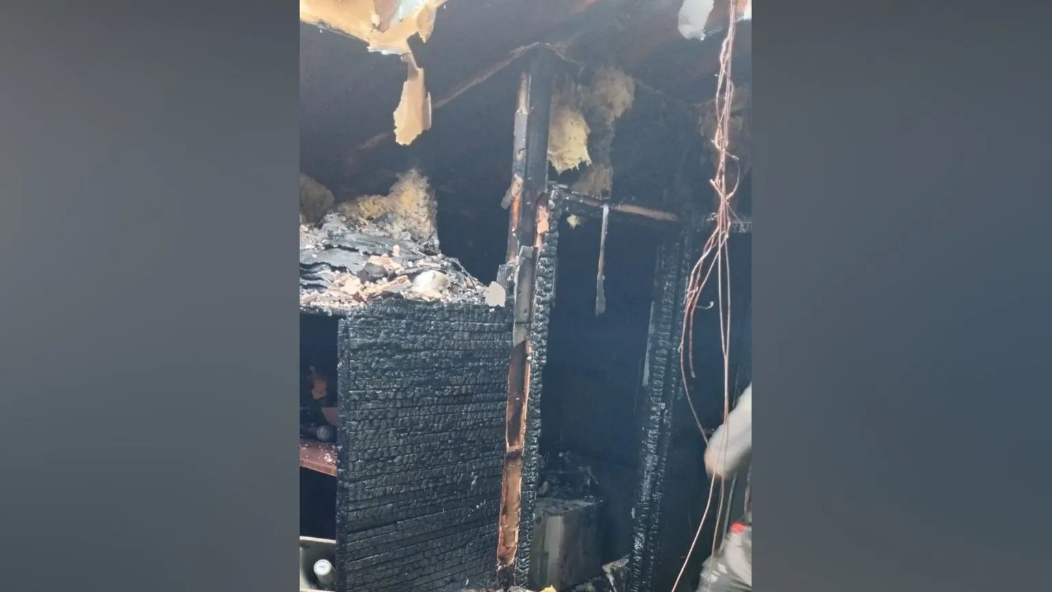 Tom Elliott A cupboard is black from heavy charring.