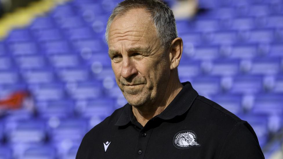 John Cartwright looks on