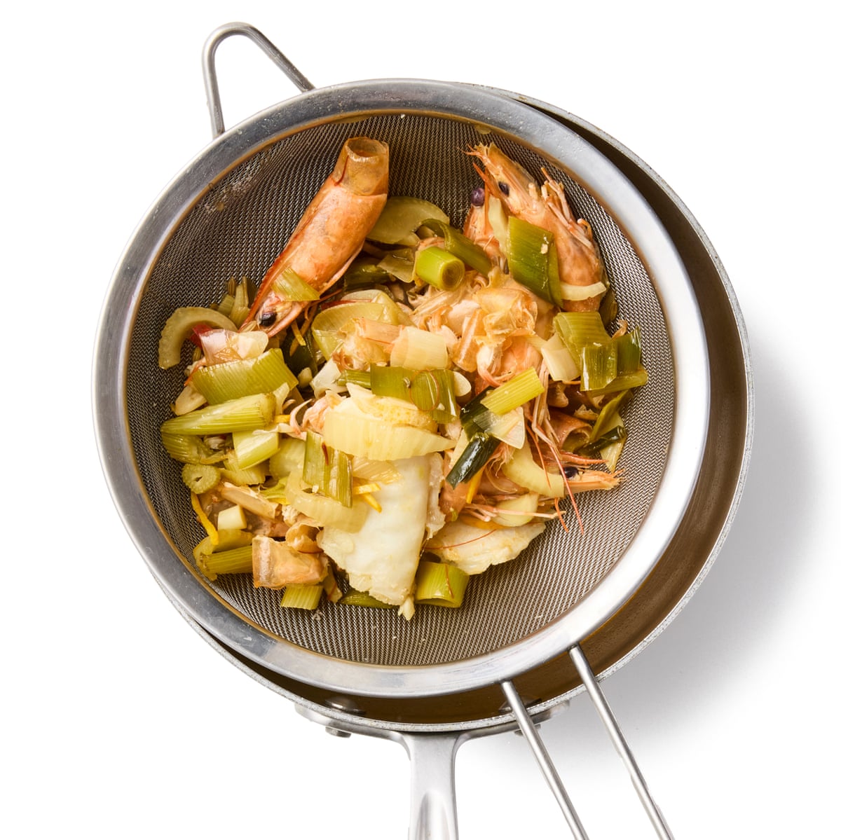 Felicity Cloake’s provencal fish stew 04b. Sieve full of stock items – prawn shells veg and so on.