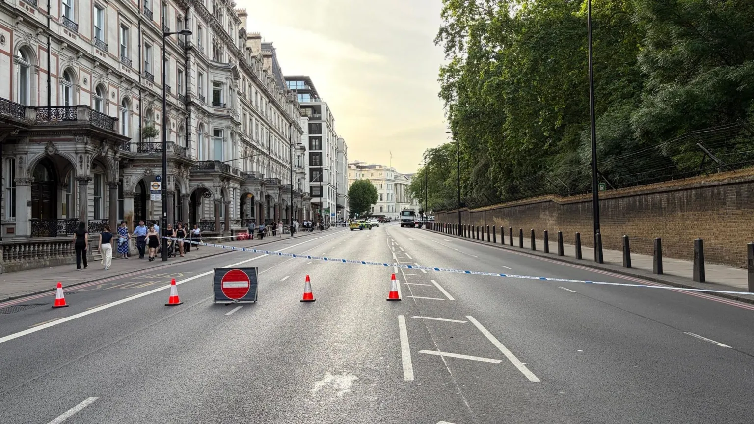 Dual carriageway is empty and closed with police tape.