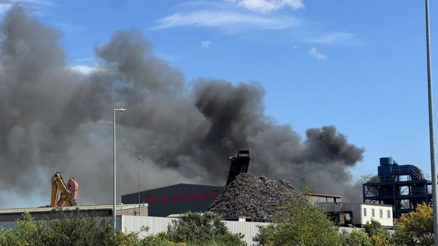 Smoke rising from a site in Belfast's East Twin Road. There is a crane to the left.