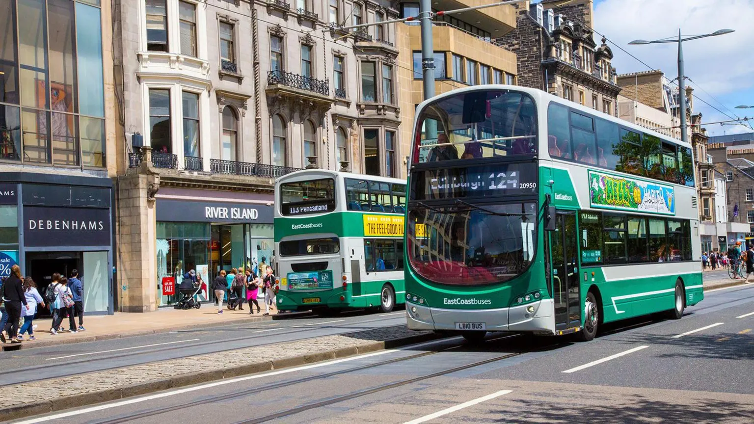 Lothian Two Lothian country buses on Princes Street in Edinburgh.