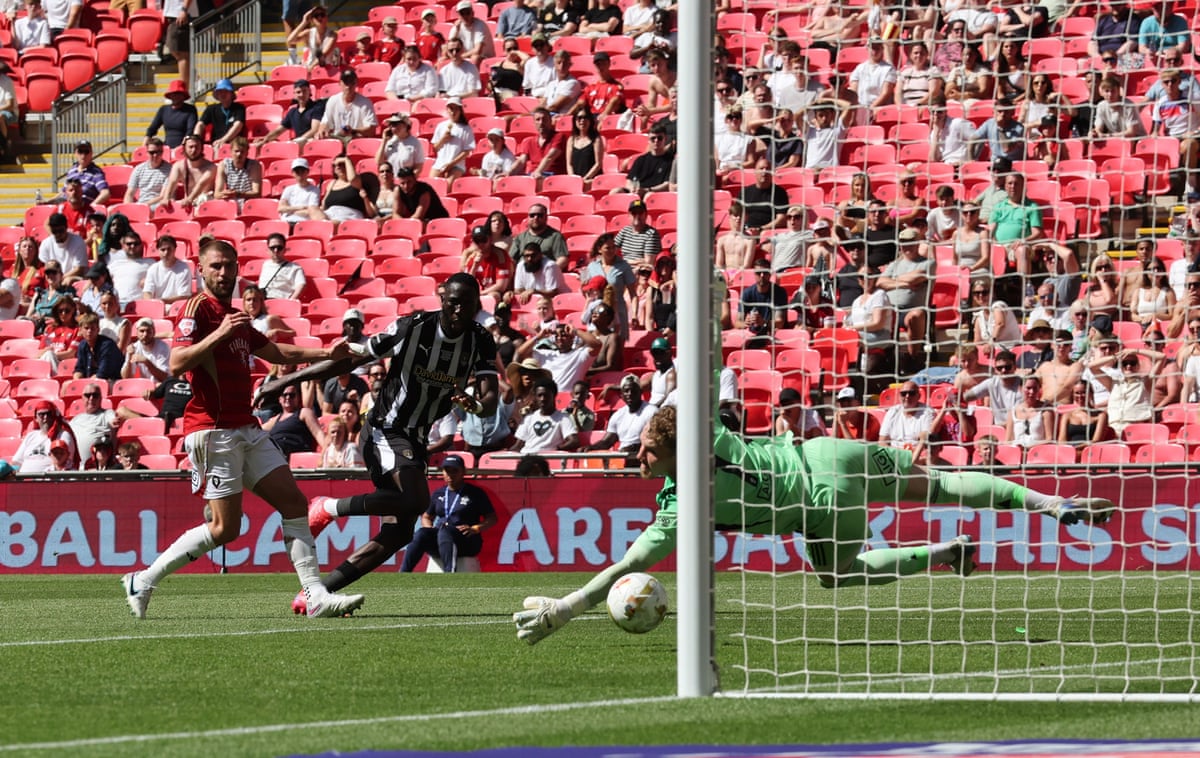 Alassana Jatta of Notts County scores the opening goal past Goalkeeper Matthew Young.