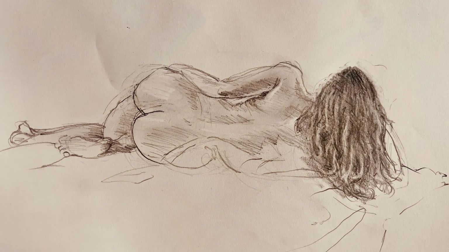 Supplied A charcoal sketch of Hollie lying on a blanket as she poses for a life drawing class.