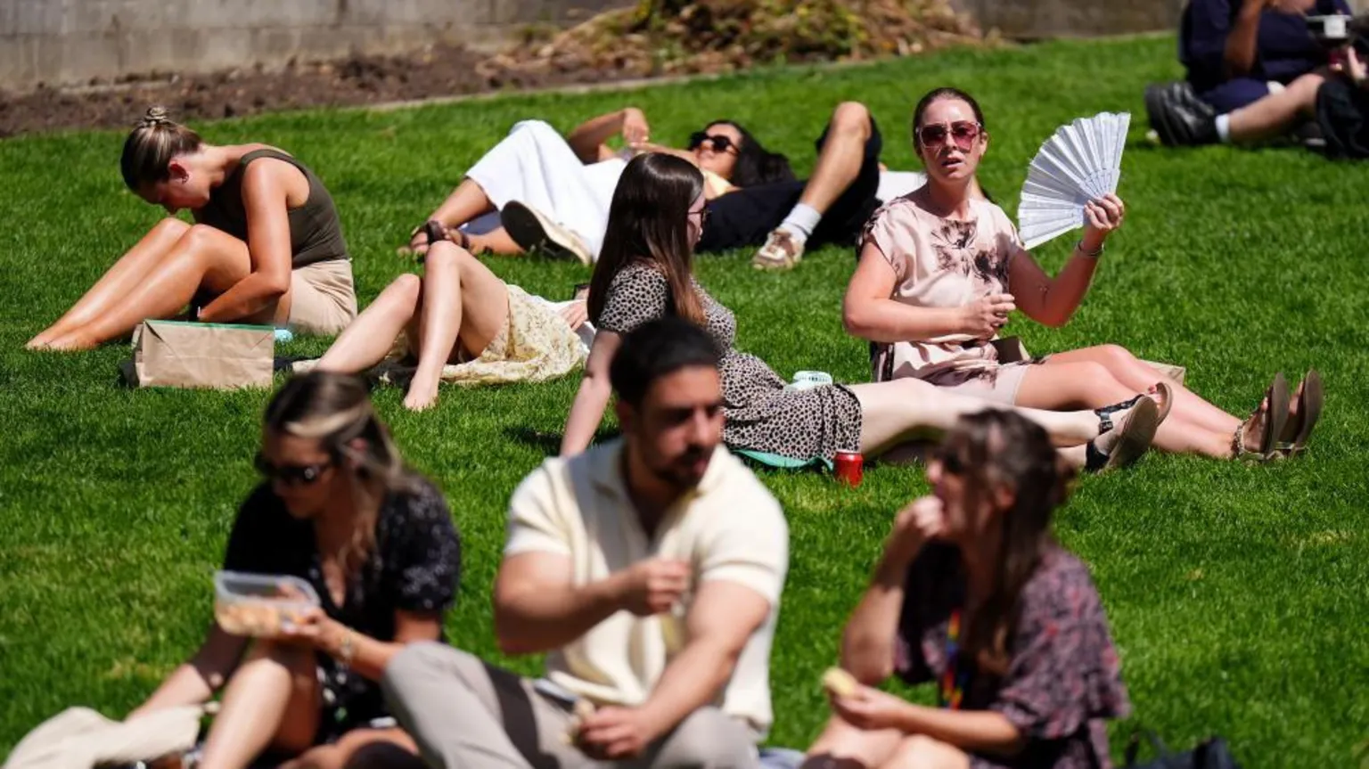  People sunbathing near St Paul's Cathedral in London