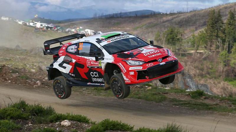 Elfyn Evans Toyota Yaris takes to the air on a gravel track at the 2026 Rally de Portugal