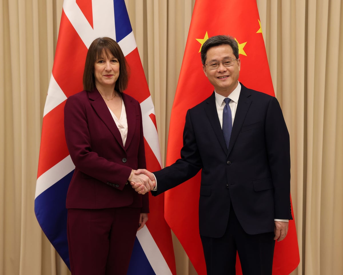 Reeves and Lan shaking hands