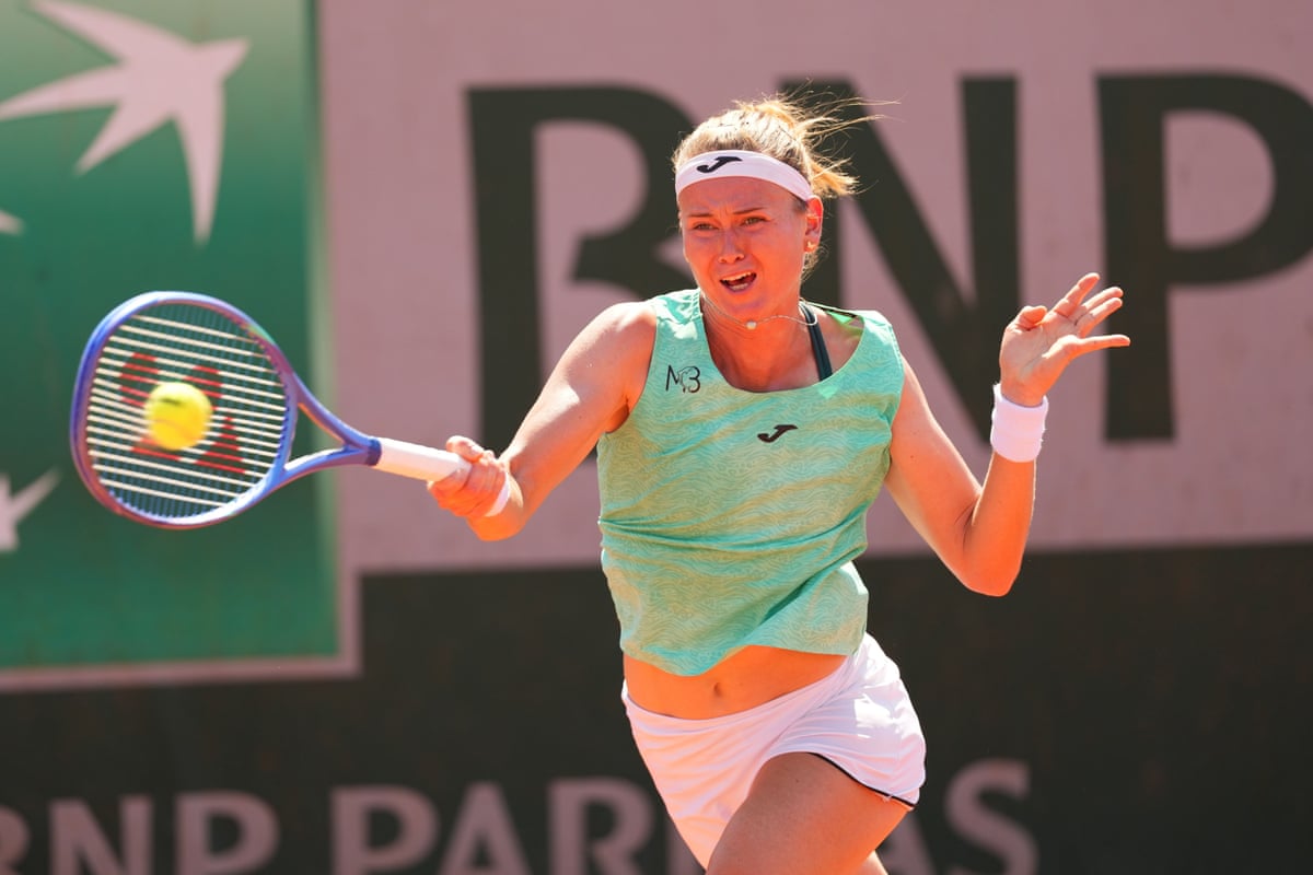 Marie Bouzkova, the Czech tennis player, makes a forehand return on the run during her French Open second run victory against Fran Jones.