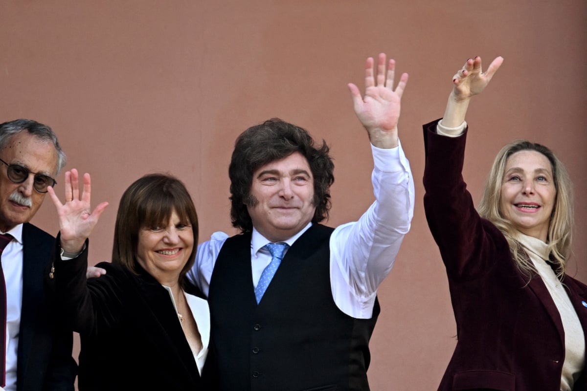Argentina’s president, Javier Milei (centre), Senator Patricia Bullrich (second left) wave from the balcony of the Casa Rosada presidential palace.