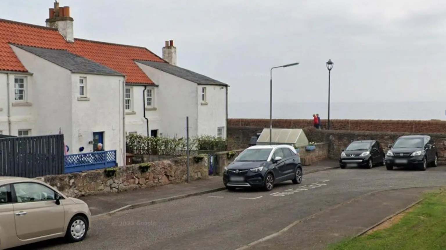 Google A row of white terraced houses.