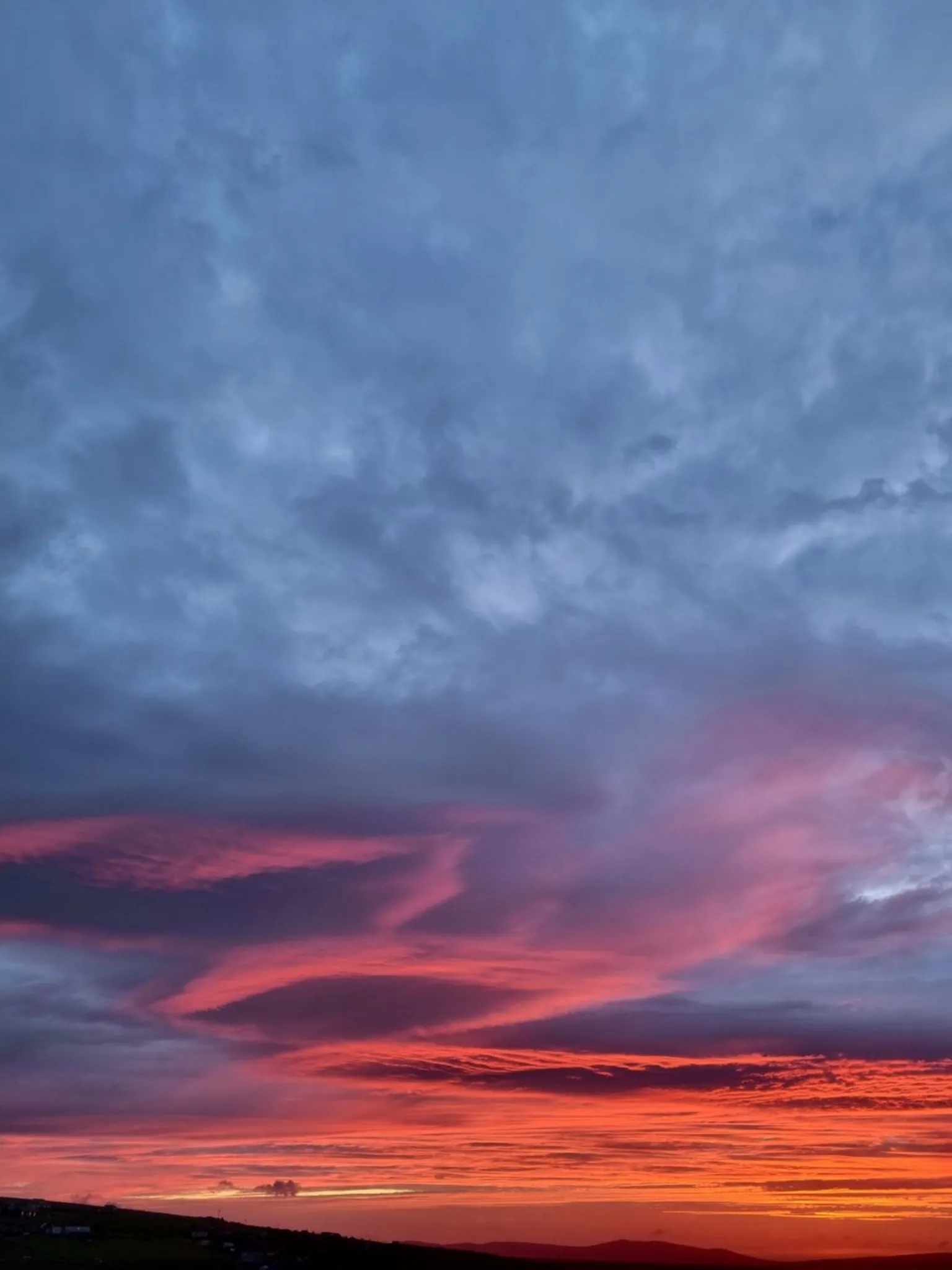 Sebastian Griffiths A sunset with grey clouds above