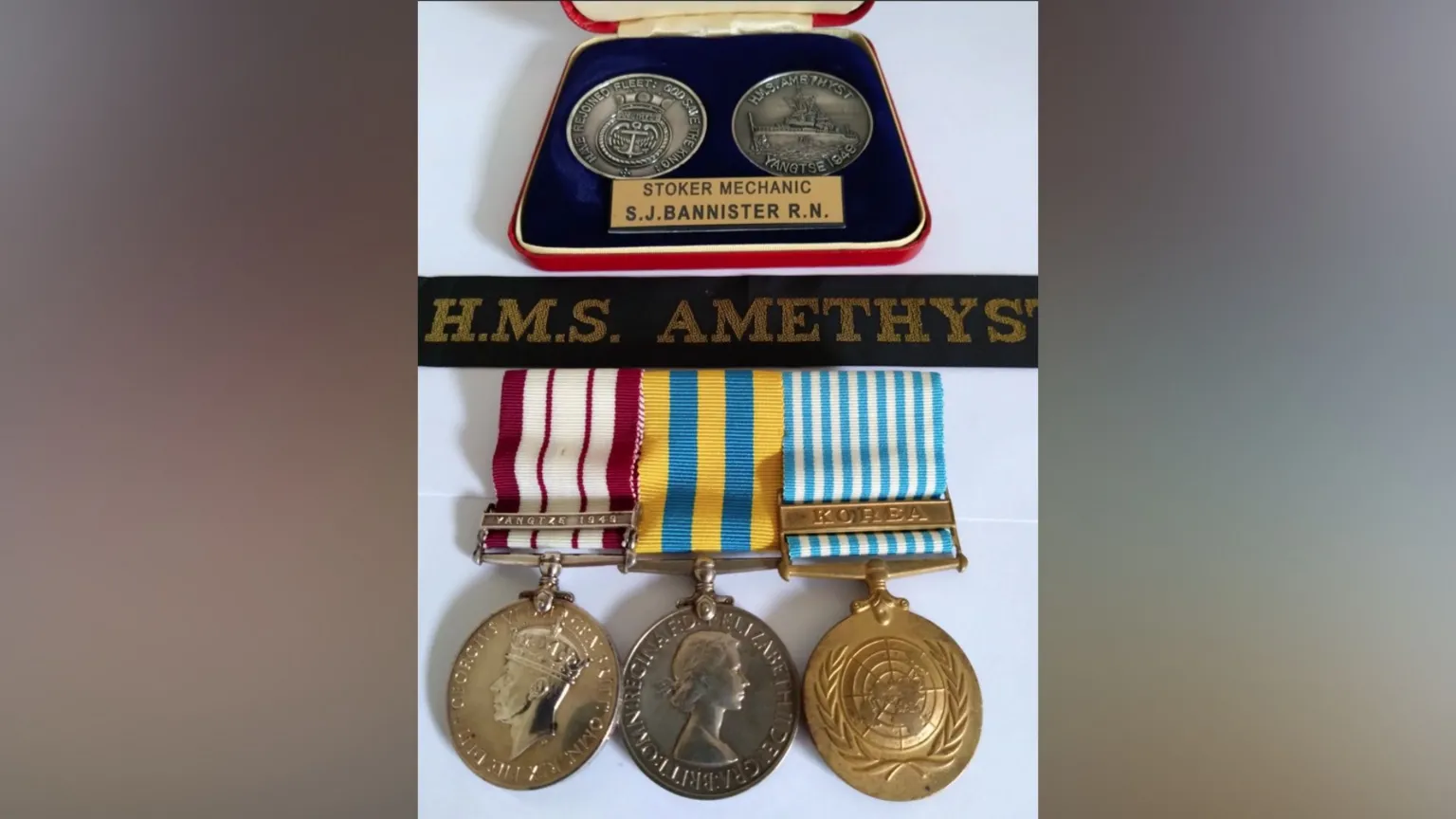 Andrew Bannister Sammy Bannister's medals, three have striped ribbons and two are in a case.