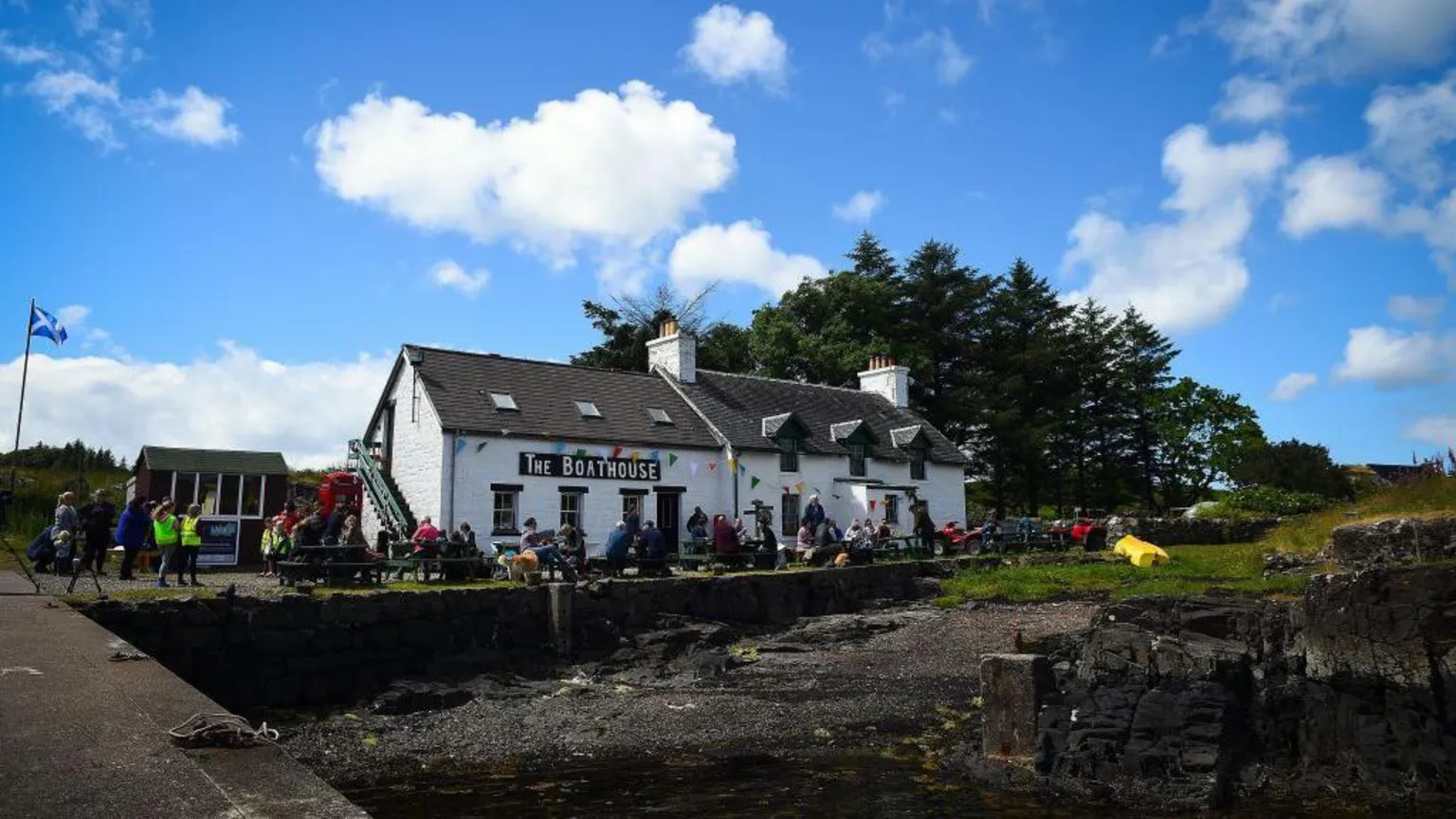  The Boathouse pub/restaurant, a while walled building on the island docks. 