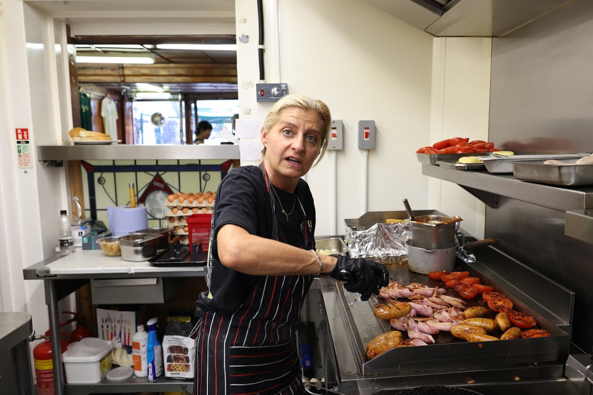Anna Pellicci, at E Pellicci cafe in Bethnal Green, cooks a breakfast in the kitchen