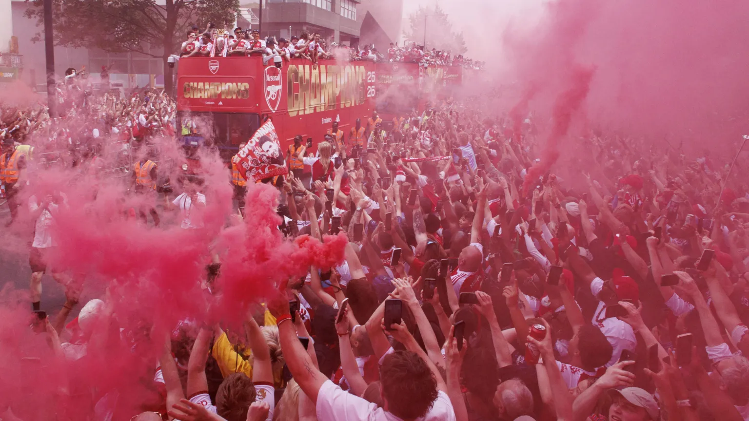 EPA Arsenal players celebrate with the Premier League trophy on an open-top bus during Arsenal Champions Parade in north London on Sunday. 