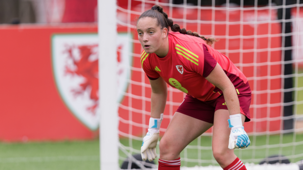 Soffia Kelly wears all red kit of Wales